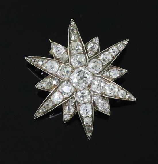 A Victorian gold, silver and old mine and cushion cut diamond set starburst pendant brooch,